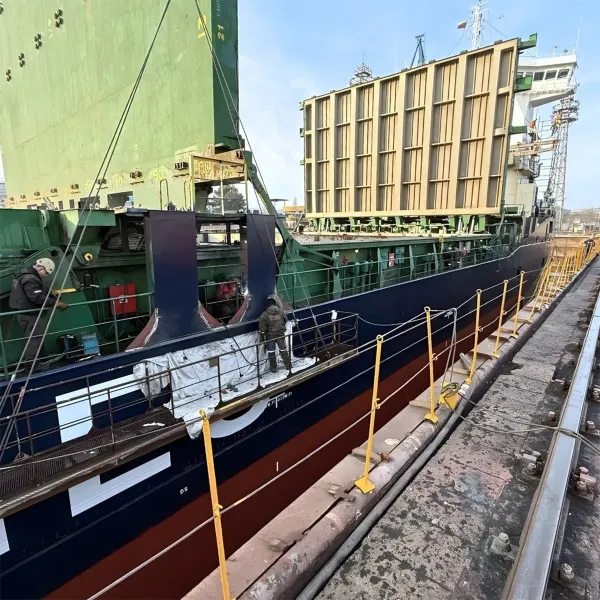 Ship repair team working along the vessel hull during dry dock support
