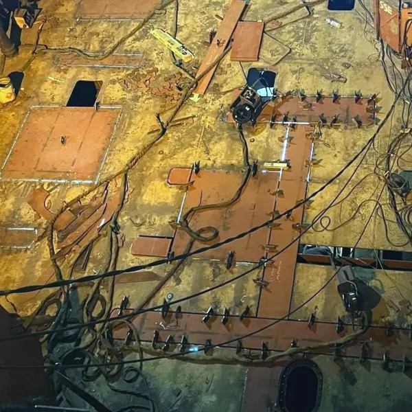 Steel insert plates fitted and prepared for welding during vessel structural repair