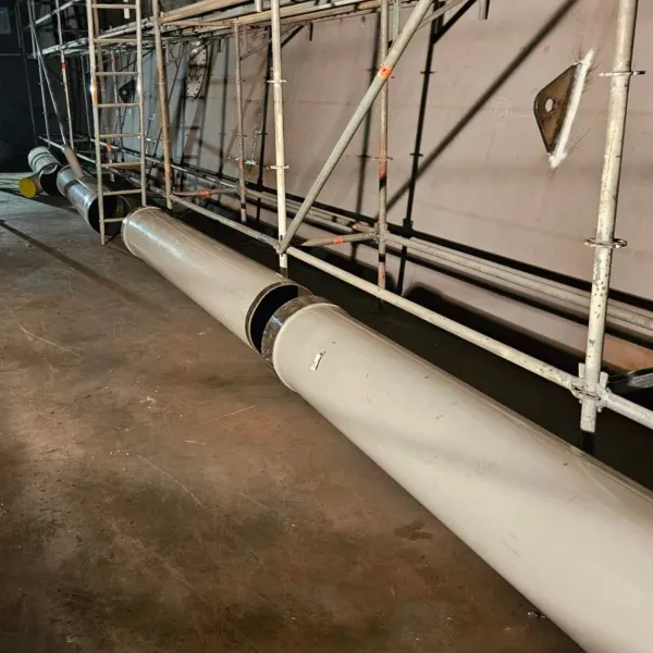 Large-diameter pipe sections aligned for onboard pipe fit-up and installation