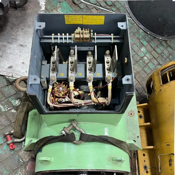 Open ship electric motor or generator terminal box with power connections and internal wiring