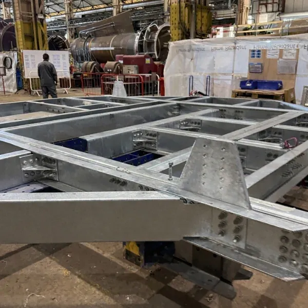 Galvanised steel base frame with beams, gusset plates and bolted connections