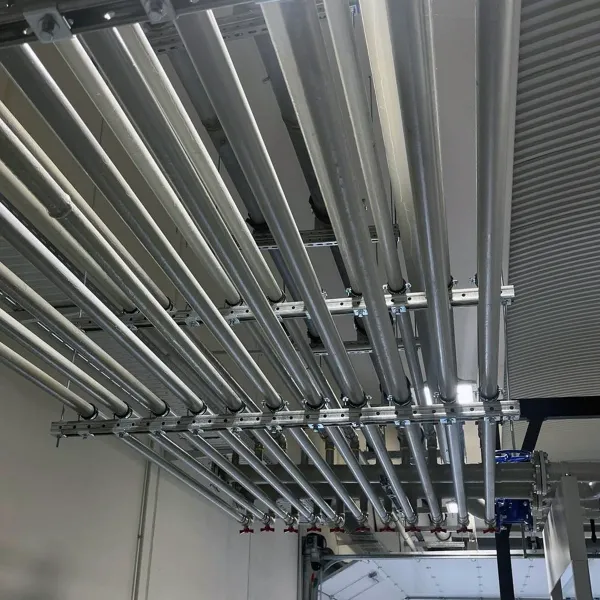 Stainless steel process pipelines installed on overhead pipe support rails