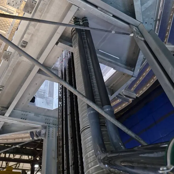 Industrial pipework and insulated utility lines installed through a steel structure