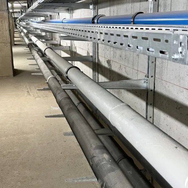 Industrial utility pipelines installed on steel support brackets