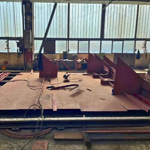 Structural steel components fabricated in workshop and prepared for ship repair and dry dock support.