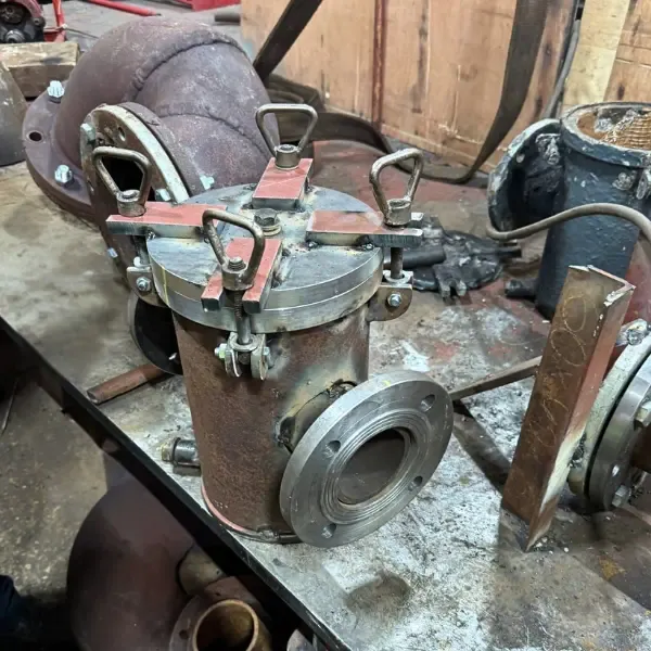 Marine strainer with bolted cover and flanged connection prepared for ship piping repair and onboard installation.