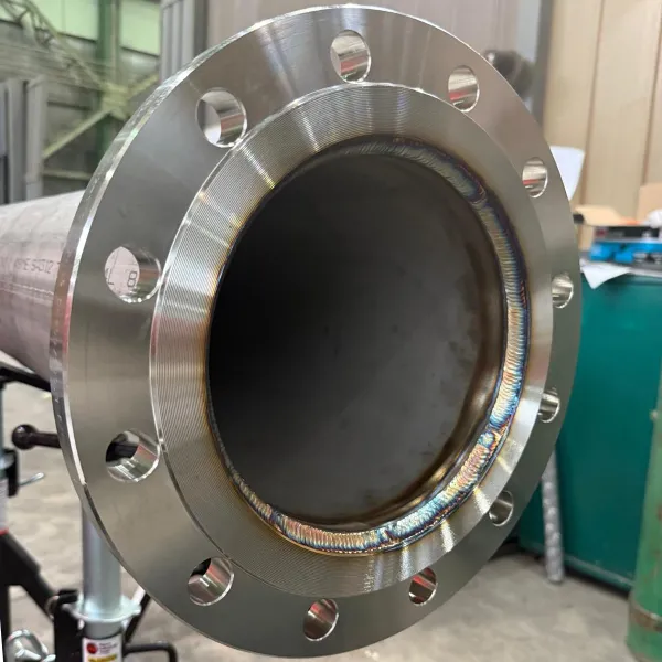 welded flange connection on a marine pipe spool during piping prefabrication for ship repair.  Tags