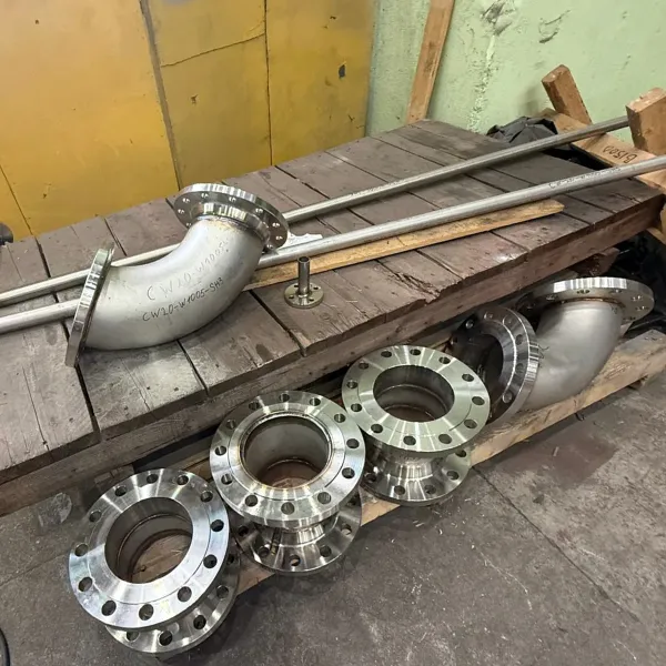 Prefabricated marine pipe spools with flanged connections prepared for onboard piping installation during ship repair.
